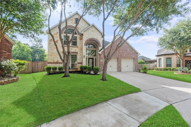 4403 Lodge Vine Ct, Sugar Land, TX 77479 - view of front facade featuring stone siding, a garage, driveway, and brick siding