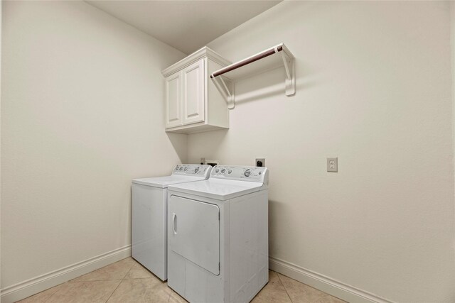 4403 Lodge Vine Ct, Sugar Land, TX 77479 - laundry room featuring cabinet space, independent washer and dryer, and light tile patterned floors
