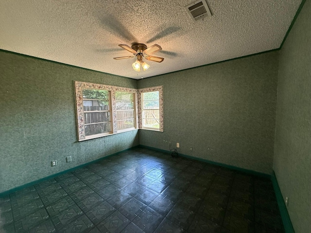 427 22nd Ave N, Texas City, TX 77590 - unfurnished room featuring a ceiling fan and a textured ceiling