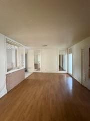 427 22nd Ave N, Texas City, TX 77590 - unfurnished living room featuring wood finished floors