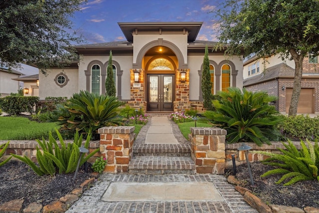 17310 Venado Dr, Cypress, TX 77433 - view of exterior entry featuring french doors and stucco siding