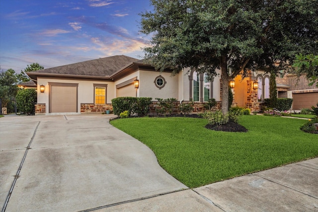 17310 Venado Dr, Cypress, TX 77433 - view of front of house featuring stucco siding, a garage, driveway, and a lawn