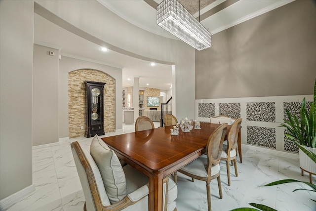 17310 Venado Dr, Cypress, TX 77433 - dining room with light marble finish floors, a chandelier, ornamental molding, and recessed lighting