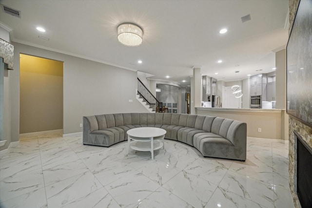 17310 Venado Dr, Cypress, TX 77433 - living room featuring stairs, recessed lighting, crown molding, light marble finish floors, and a fireplace