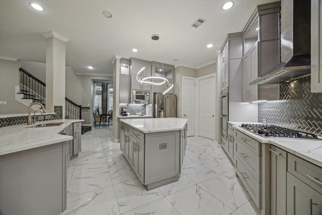 17310 Venado Dr, Cypress, TX 77433 - kitchen featuring stainless steel appliances, crown molding, wall chimney range hood, gray cabinets, and recessed lighting