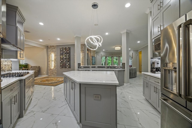 17310 Venado Dr, Cypress, TX 77433 - kitchen with stainless steel appliances, gray cabinets, ornamental molding, light marble finish flooring, and recessed lighting