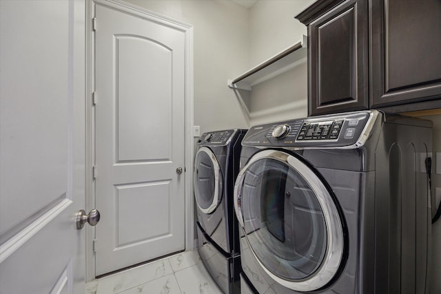17310 Venado Dr, Cypress, TX 77433 - washroom with light marble finish flooring, washing machine and dryer, and cabinet space