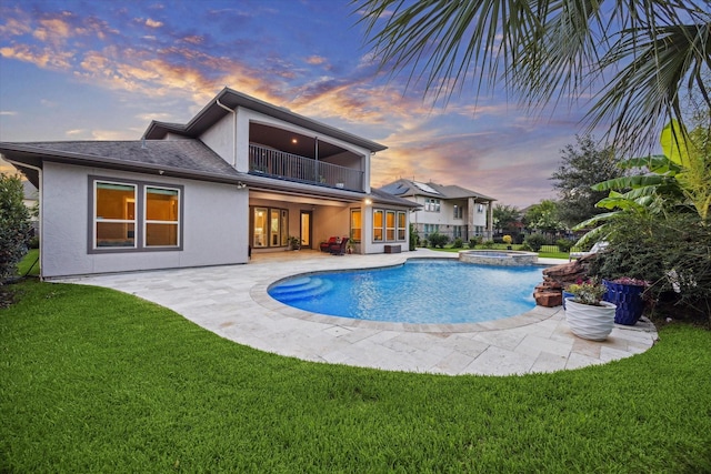 17310 Venado Dr, Cypress, TX 77433 - view of swimming pool featuring a lawn, a patio area, and a pool with connected hot tub
