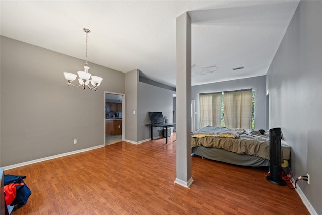 30927 N Head Dr, Spring, TX 77386 - bedroom with wood finished floors and a chandelier