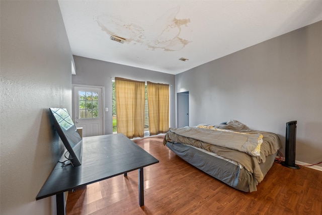 30927 N Head Dr, Spring, TX 77386 - bedroom featuring wood finished floors and access to outside