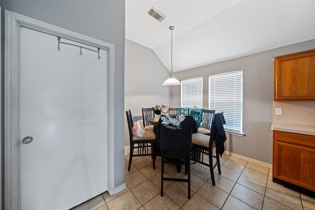 30927 N Head Dr, Spring, TX 77386 - dining room with lofted ceiling and light tile patterned floors