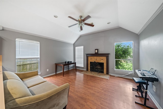 30927 N Head Dr, Spring, TX 77386 - living room featuring ceiling fan, lofted ceiling, a fireplace, and wood finished floors