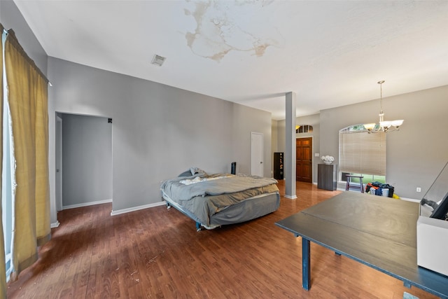 30927 N Head Dr, Spring, TX 77386 - bedroom featuring a chandelier and wood finished floors