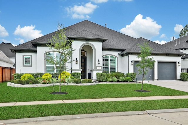 5350 Cherry Spring Dr, Spring, TX 77386 - french provincial home featuring stucco siding, roof with shingles, an attached garage, and driveway
