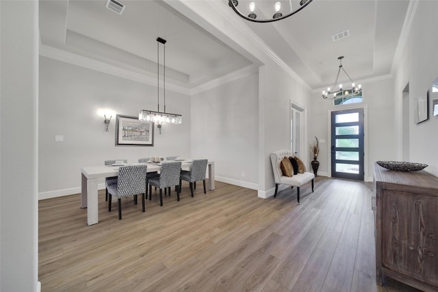 5350 Cherry Spring Dr, Spring, TX 77386 - dining area featuring a chandelier, a raised ceiling, light wood finished floors, and ornamental molding