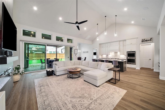 5350 Cherry Spring Dr, Spring, TX 77386 - living room featuring high vaulted ceiling, ceiling fan, light wood-type flooring, and recessed lighting