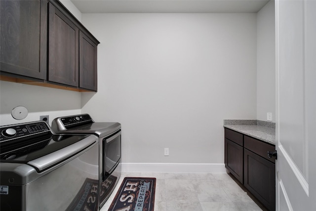 5350 Cherry Spring Dr, Spring, TX 77386 - laundry area with cabinet space and washer and clothes dryer