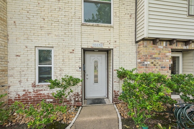 10676 Hazelhurst Dr, Houston, TX 77043 - view of exterior entry featuring brick siding