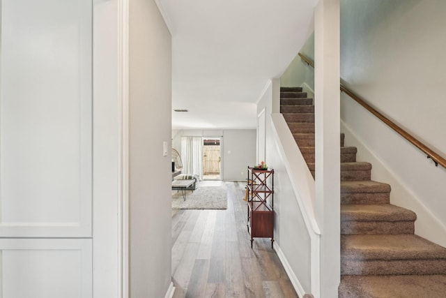 10676 Hazelhurst Dr, Houston, TX 77043 - staircase featuring wood finished floors