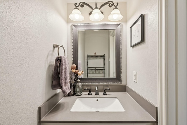 10676 Hazelhurst Dr, Houston, TX 77043 - bathroom featuring a textured wall and vanity