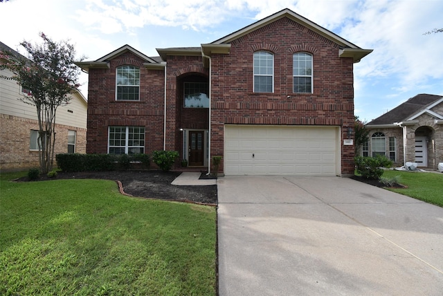 2611 Sandy Mist Ct, Katy, TX 77494 - traditional-style house with driveway, an attached garage, a front lawn, and brick siding
