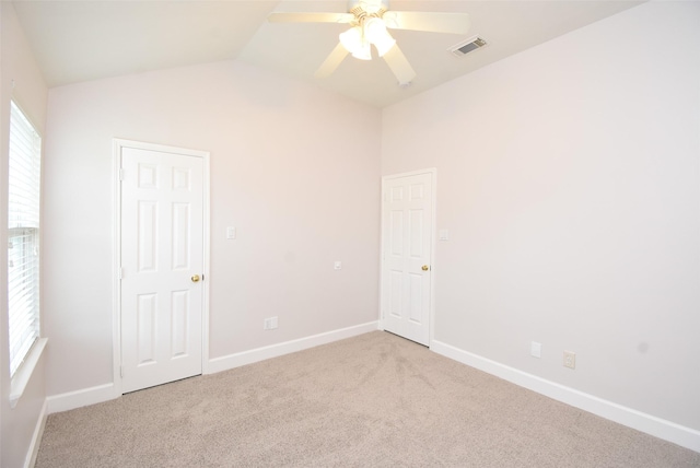 2611 Sandy Mist Ct, Katy, TX 77494 - unfurnished bedroom featuring light colored carpet, vaulted ceiling, and ceiling fan