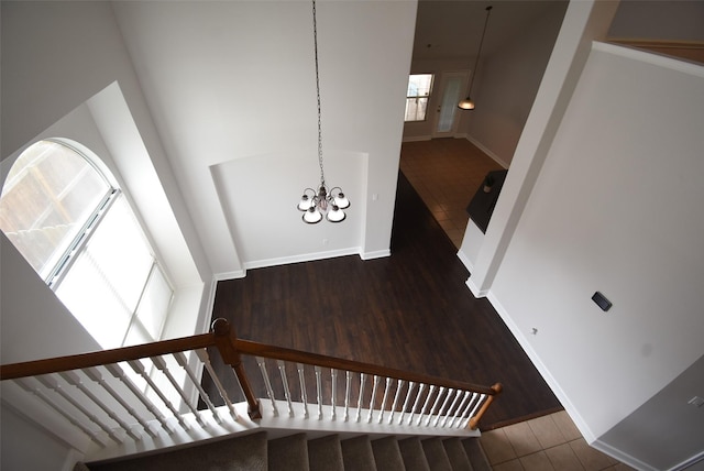 2611 Sandy Mist Ct, Katy, TX 77494 - stairs with a chandelier and wood finished floors