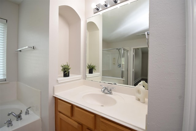 2611 Sandy Mist Ct, Katy, TX 77494 - bathroom featuring vanity, a stall shower, and a garden tub