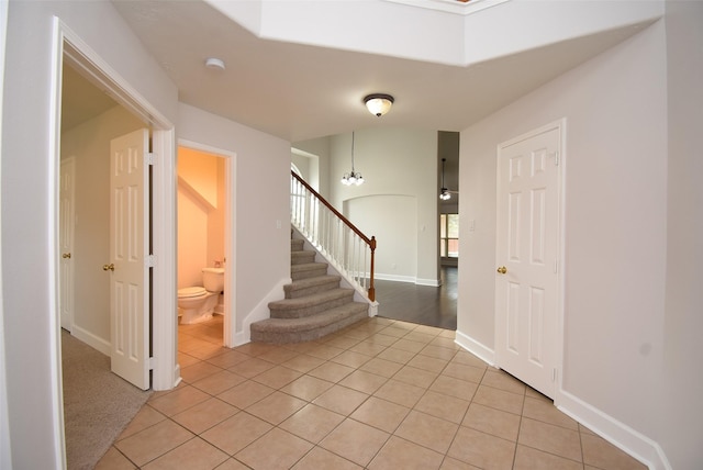 2611 Sandy Mist Ct, Katy, TX 77494 - entryway with light tile patterned floors and stairway
