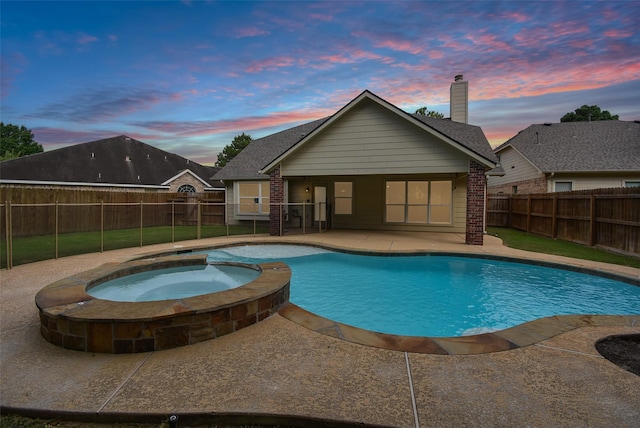 2611 Sandy Mist Ct, Katy, TX 77494 - view of pool featuring a patio, a pool with connected hot tub, and a fenced backyard