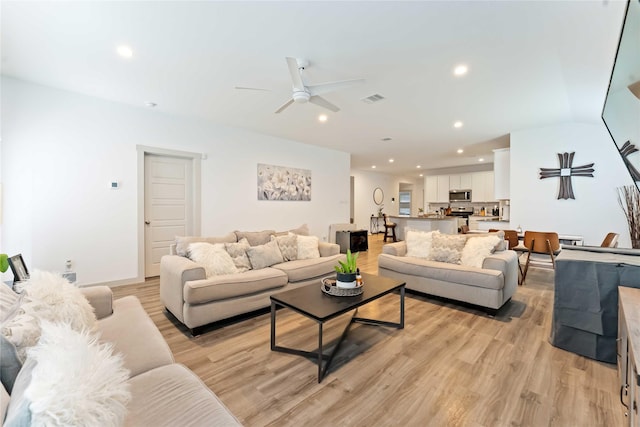 7902 Sleek Flock Ln, Rosharon, TX 77583 - living room featuring light wood-style flooring, ceiling fan, and recessed lighting