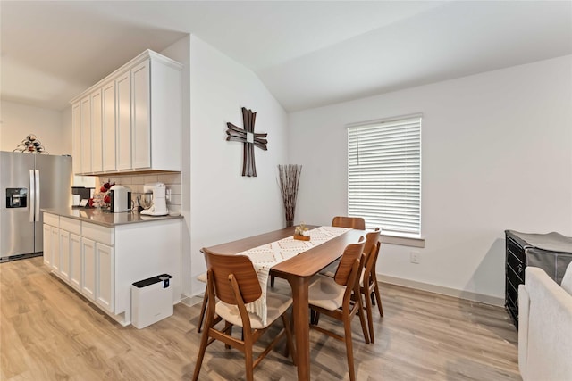 7902 Sleek Flock Ln, Rosharon, TX 77583 - dining room with light wood finished floors and vaulted ceiling