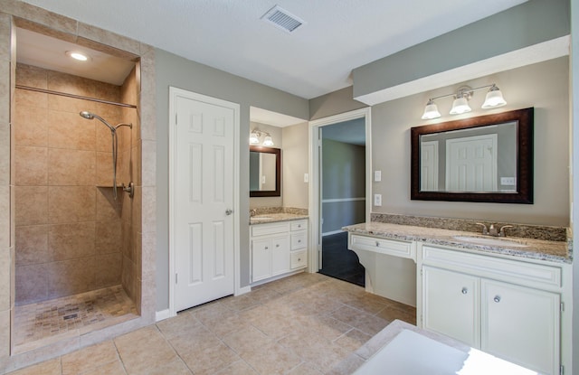 1511 Calveryman Ln, Katy, TX 77449 - full bath featuring tiled shower, vanity, and tile patterned floors