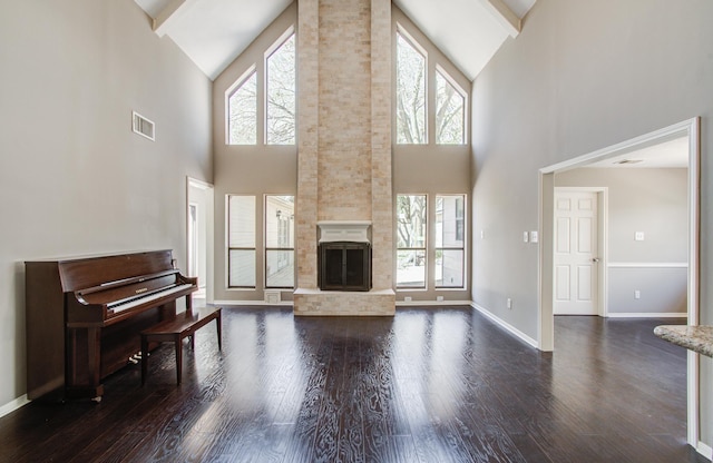 1511 Calveryman Ln, Katy, TX 77449 - living area featuring high vaulted ceiling, dark wood-type flooring, and a fireplace
