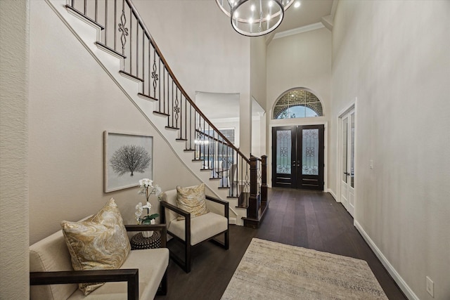 1923 Rice Mill Dr, Katy, TX 77493 - foyer entrance with stairs, a chandelier, dark wood-style flooring, a high ceiling, and french doors