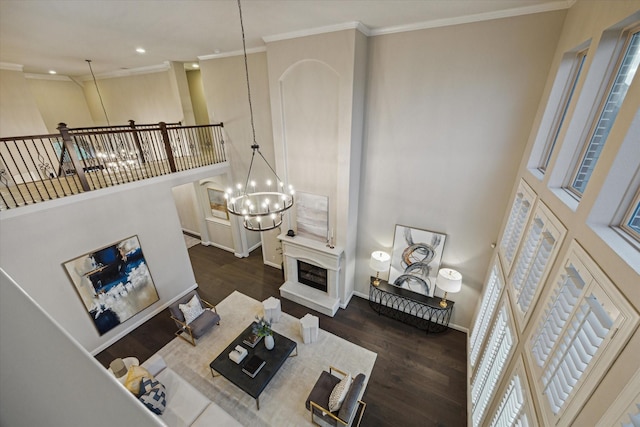 1923 Rice Mill Dr, Katy, TX 77493 - living room featuring a chandelier, dark wood-type flooring, ornamental molding, recessed lighting, and a towering ceiling