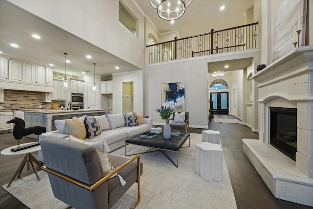 1923 Rice Mill Dr, Katy, TX 77493 - living area with wood finished floors, a high ceiling, recessed lighting, and a fireplace