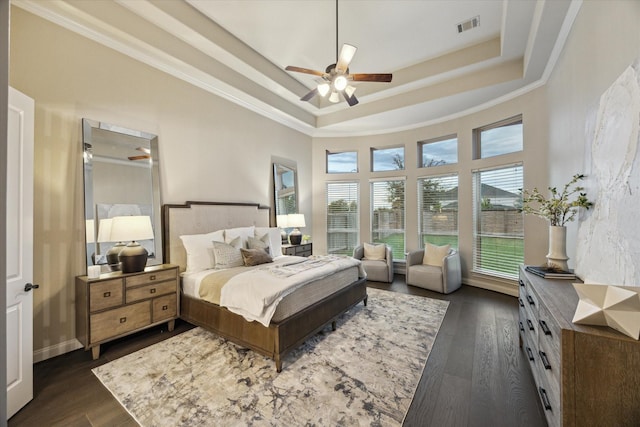 1923 Rice Mill Dr, Katy, TX 77493 - bedroom featuring a raised ceiling, dark wood-type flooring, ornamental molding, and ceiling fan