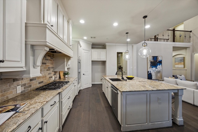 1923 Rice Mill Dr, Katy, TX 77493 - kitchen featuring stainless steel appliances, open floor plan, dark wood finished floors, decorative backsplash, and recessed lighting