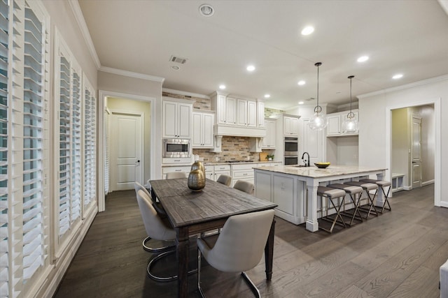 1923 Rice Mill Dr, Katy, TX 77493 - dining room with dark wood-style flooring, ornamental molding, and recessed lighting