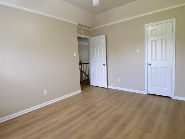 3210 Echo Mountain Dr, Houston, TX 77345 - unfurnished bedroom with light wood finished floors and ceiling fan