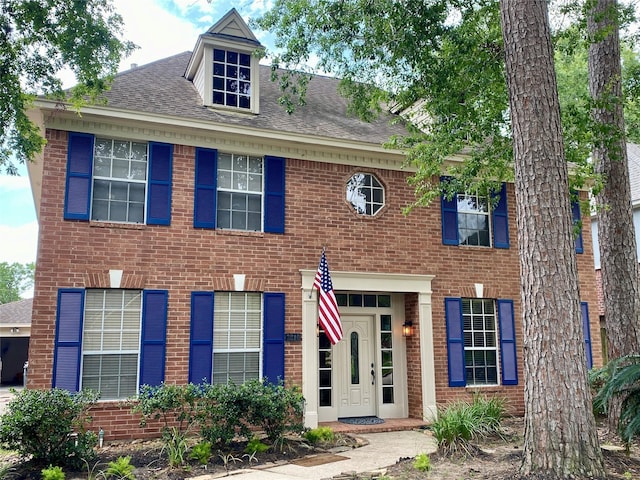 3210 Echo Mountain Dr, Houston, TX 77345 - view of front facade with a shingled roof and brick siding