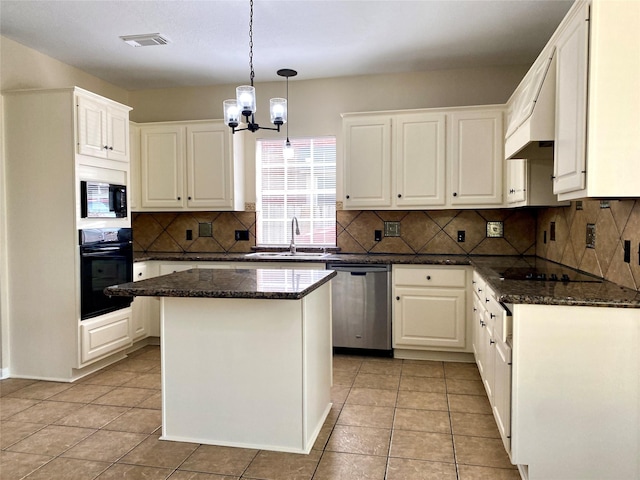 3210 Echo Mountain Dr, Houston, TX 77345 - kitchen with black appliances, a chandelier, custom range hood, and light tile patterned flooring