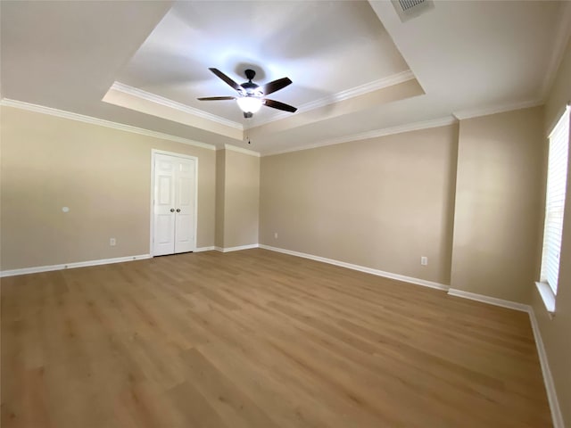 3210 Echo Mountain Dr, Houston, TX 77345 - spare room with a raised ceiling, ceiling fan, wood finished floors, and ornamental molding