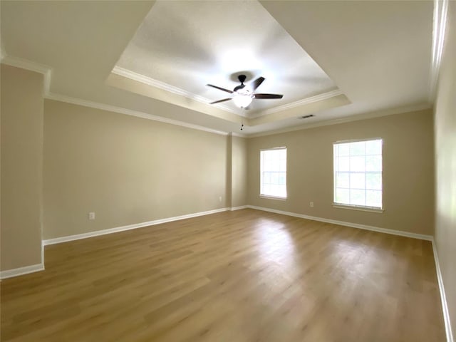 3210 Echo Mountain Dr, Houston, TX 77345 - unfurnished room with a raised ceiling, ceiling fan, wood finished floors, and ornamental molding
