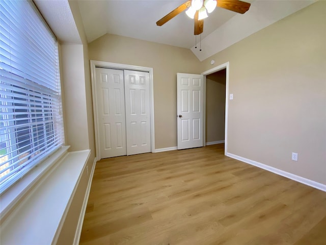 3210 Echo Mountain Dr, Houston, TX 77345 - unfurnished bedroom featuring vaulted ceiling, light wood finished floors, a closet, and ceiling fan