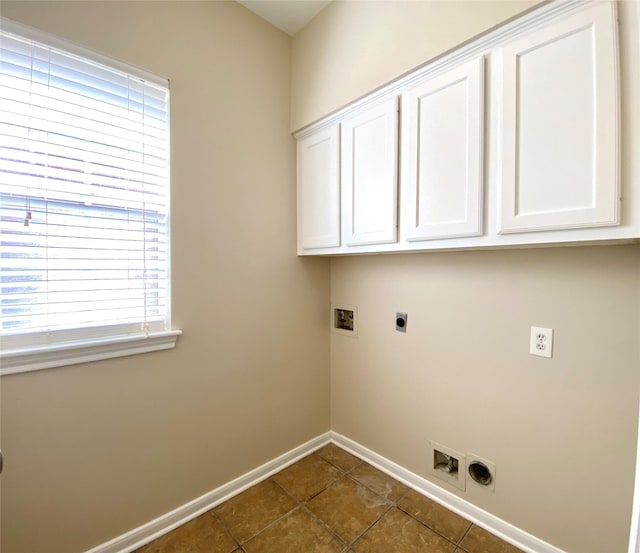 3210 Echo Mountain Dr, Houston, TX 77345 - washroom with hookup for an electric dryer, hookup for a washing machine, cabinet space, and dark tile patterned floors