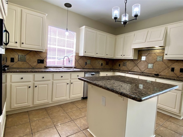 3210 Echo Mountain Dr, Houston, TX 77345 - kitchen with dishwasher, white cabinets, light tile patterned floors, and pendant lighting