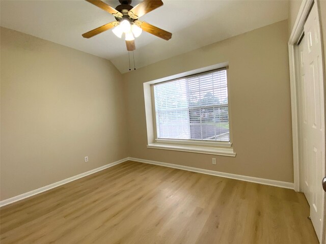 3210 Echo Mountain Dr, Houston, TX 77345 - unfurnished bedroom featuring a closet, light wood finished floors, a ceiling fan, and lofted ceiling