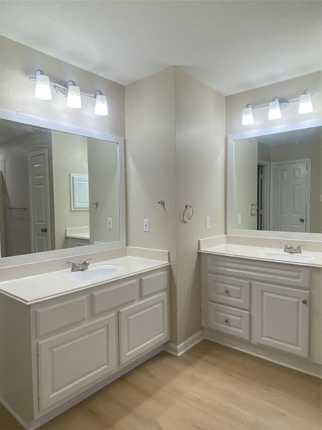 3210 Echo Mountain Dr, Houston, TX 77345 - full bath with wood finished floors and vanity